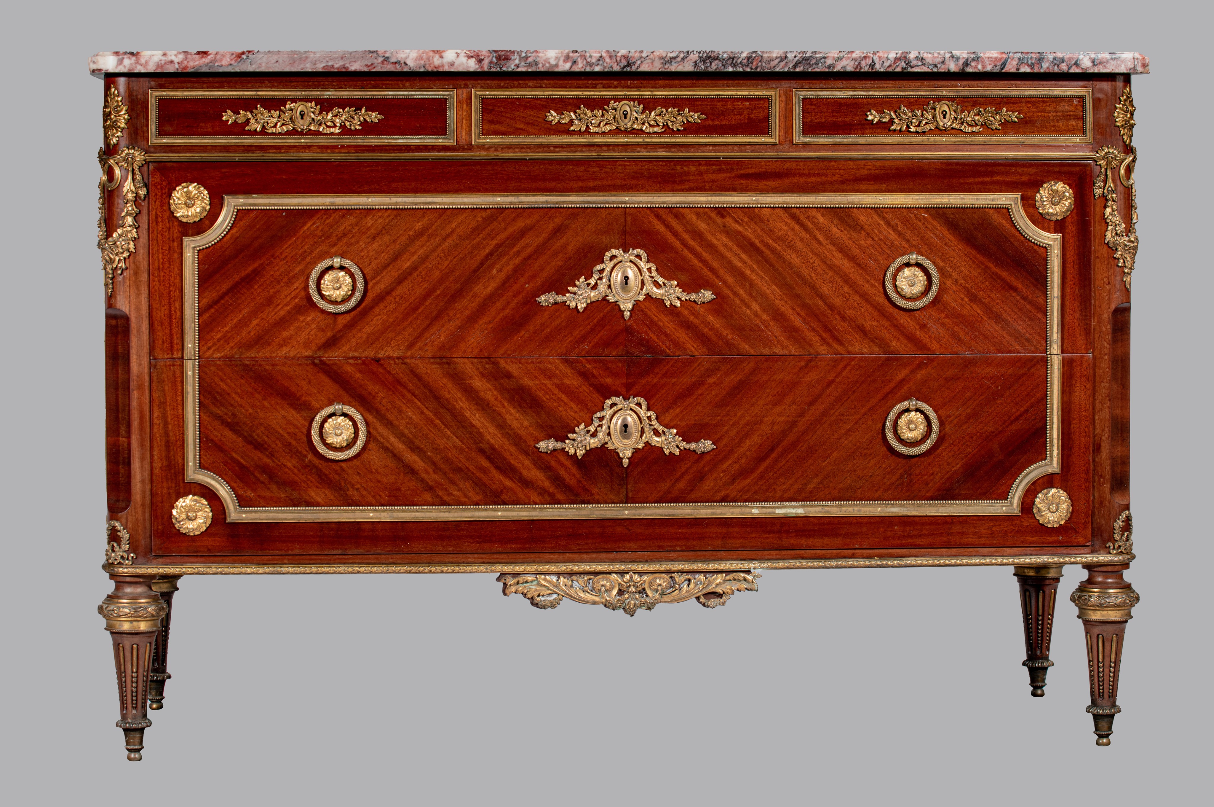 A Louis XVI style mahogany veneered commode with gilt brass mounts and marble top, H 89 - W 134 - D - Image 3 of 8