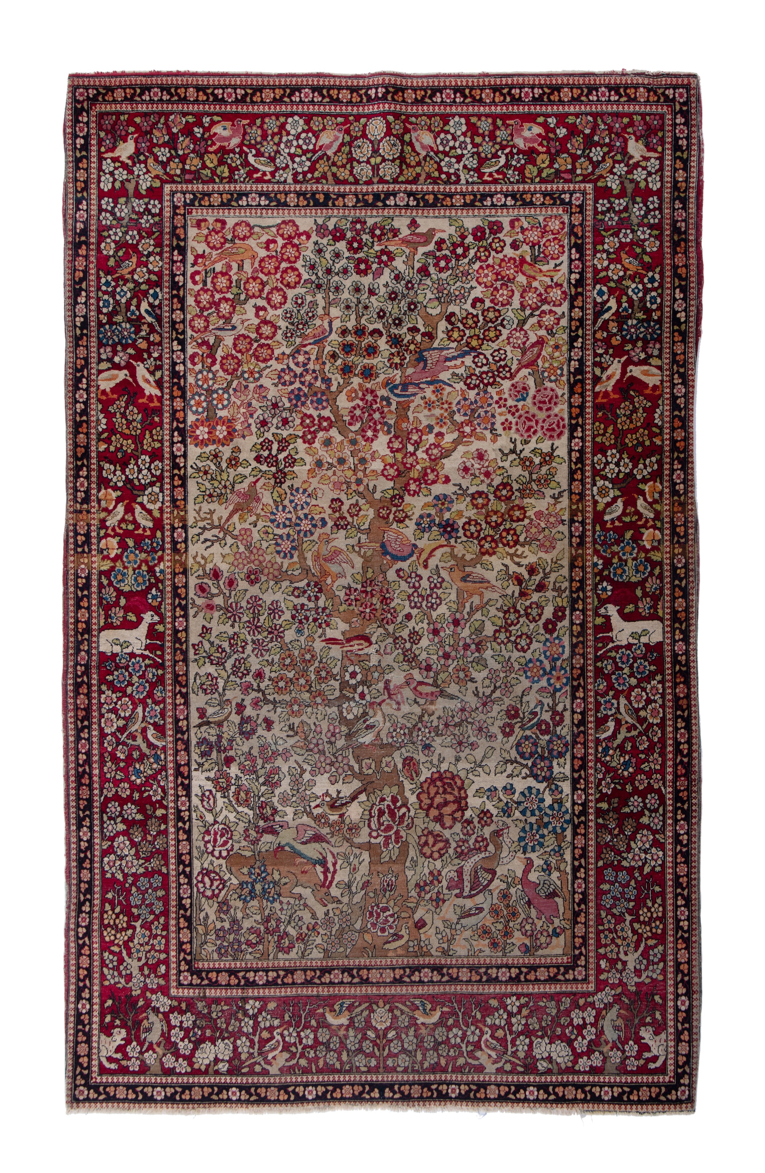 An antique Persian Ispahan rug, depicting the tree of life, 137 x 206 cm (+)