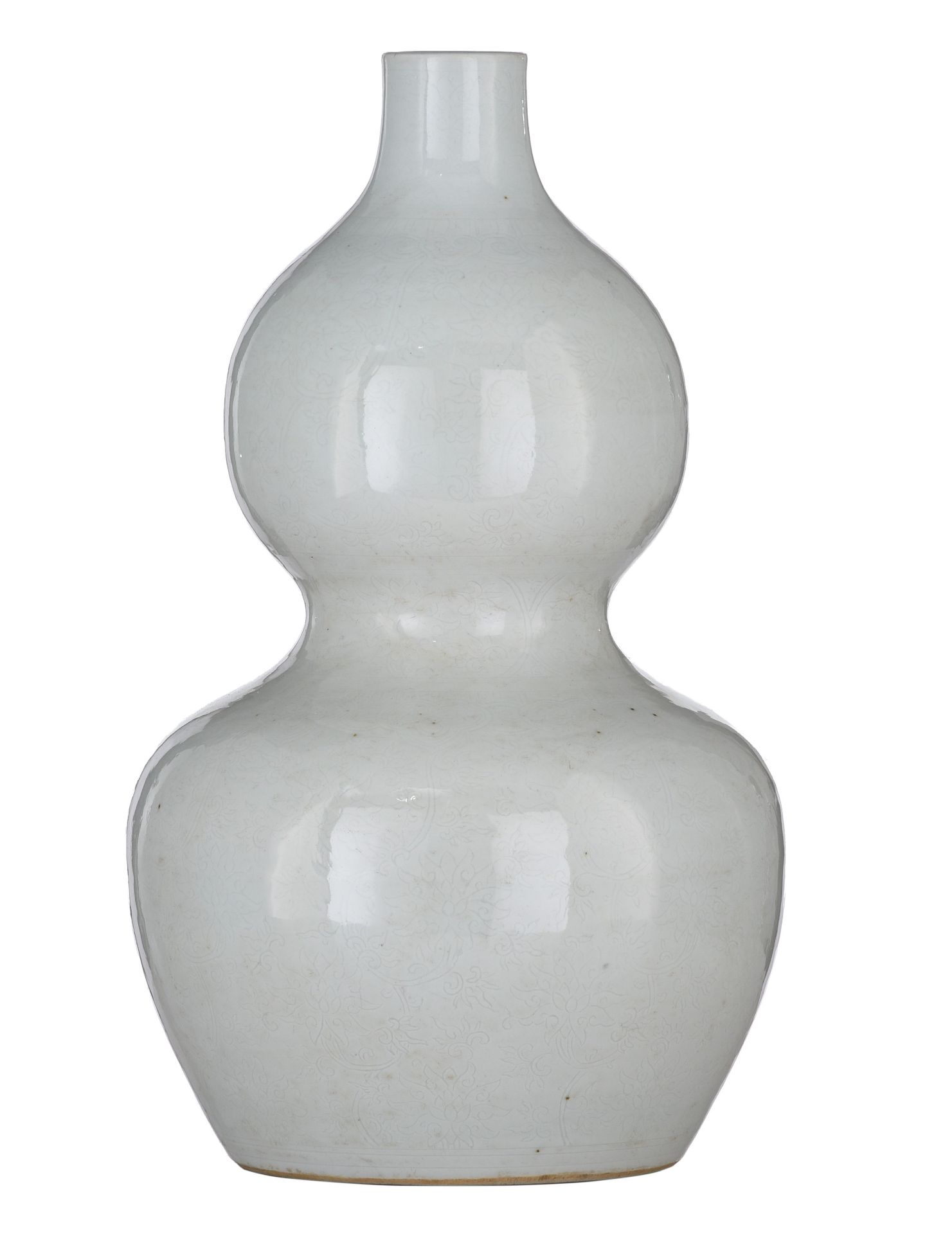 A Chinese anhua tianbai-glazed double-gourd vase, incised with 'Da Ming Wanli Nian Zhi' at the botto