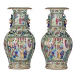 A similar pair of Chinese Canton famille rose baluster vases, paired with Fu lion handles, 19thC, H