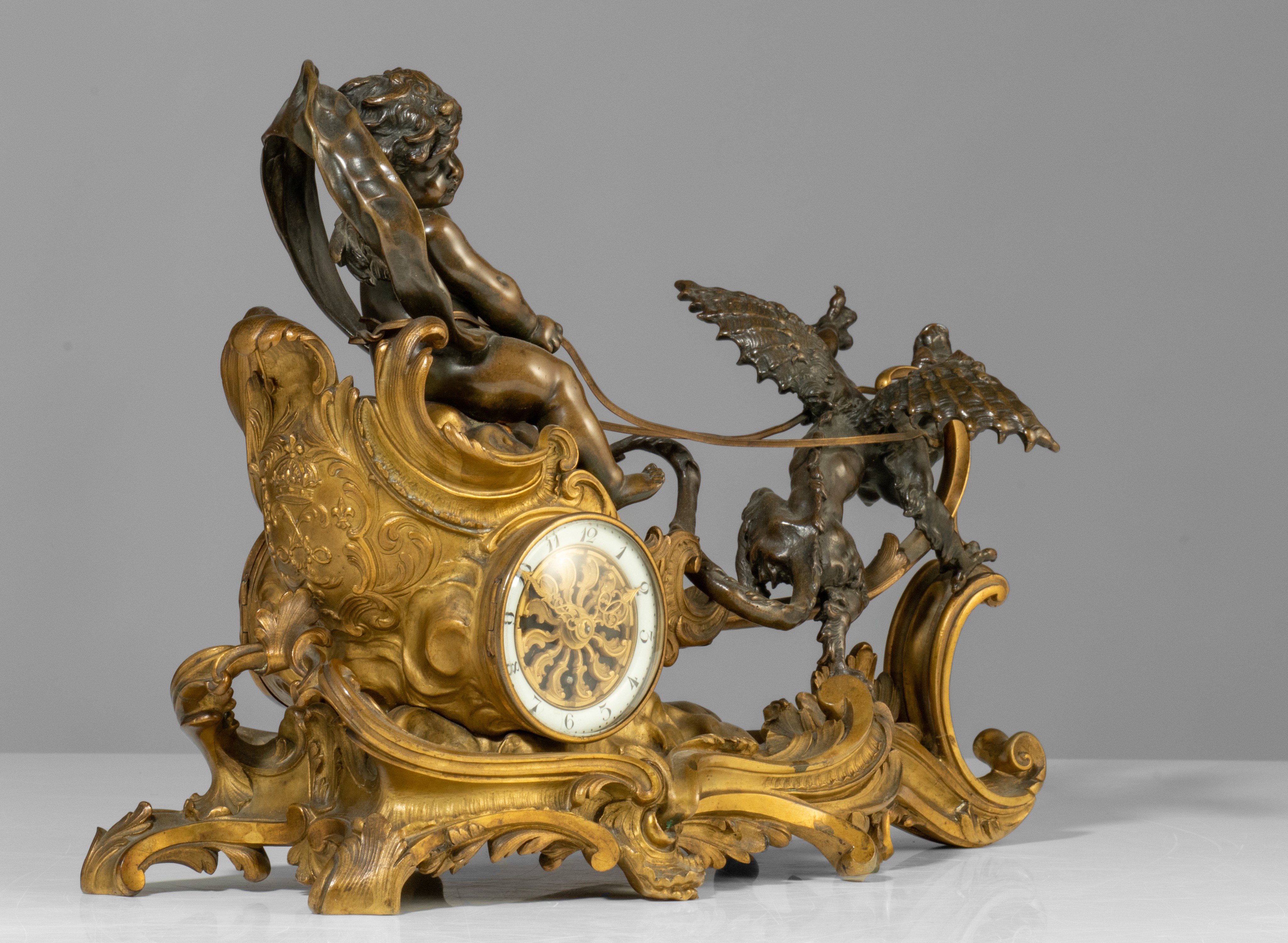 A Rococo style mantle clock with Cupid on his chariot and a pair of matching candlesticks, H 19,5 - - Image 5 of 9