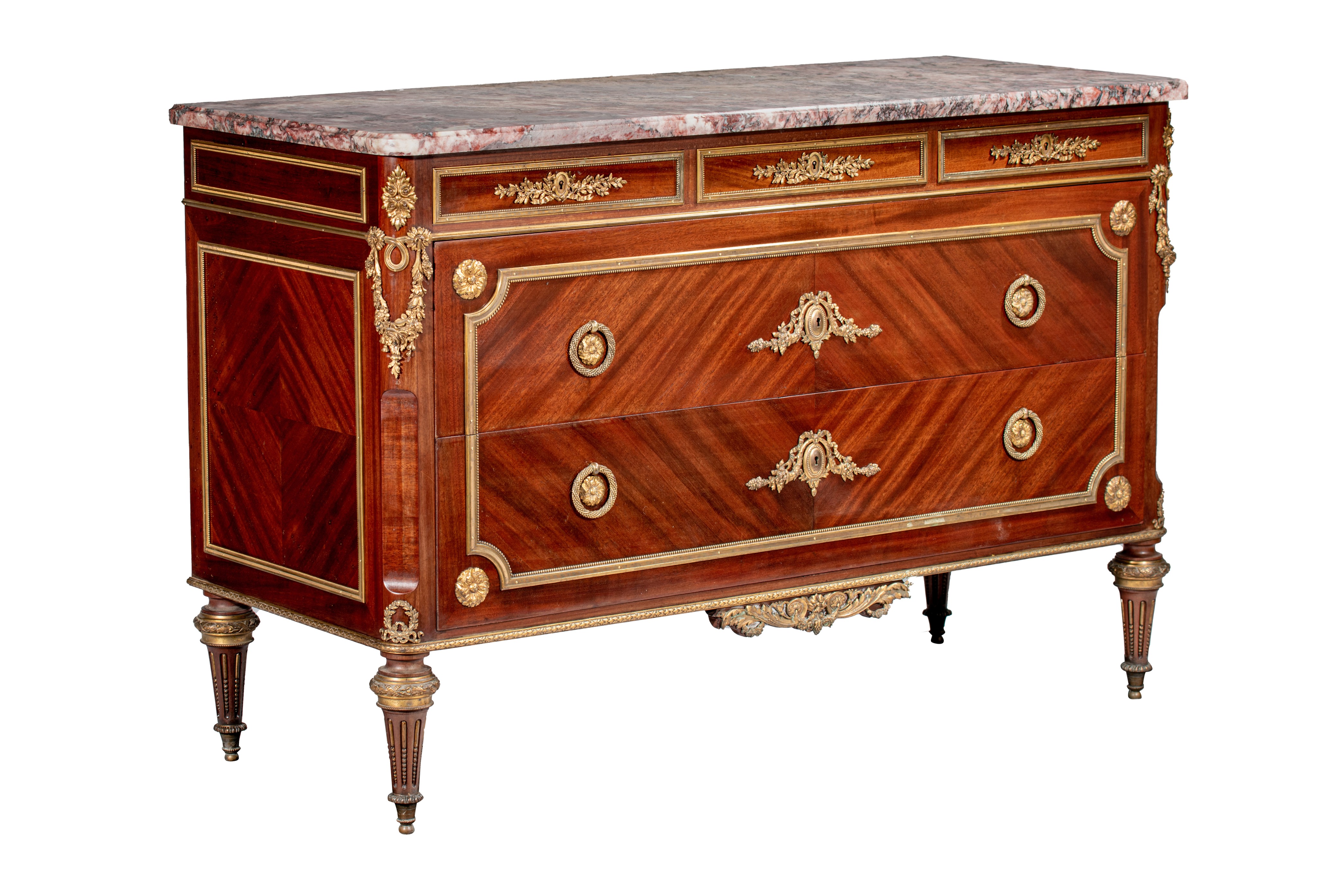 A Louis XVI style mahogany veneered commode with gilt brass mounts and marble top, H 89 - W 134 - D