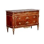 A Louis XVI style mahogany veneered commode with gilt brass mounts and marble top, H 89 - W 134 - D