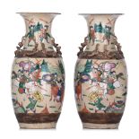 A pair of Chinese Nanking famille rose stoneware vases, 19thC, H 44 cm