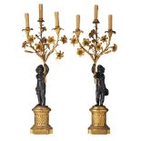 A pair of Neoclassical patinated and gilt bronze figural candelabras, H 80 cm