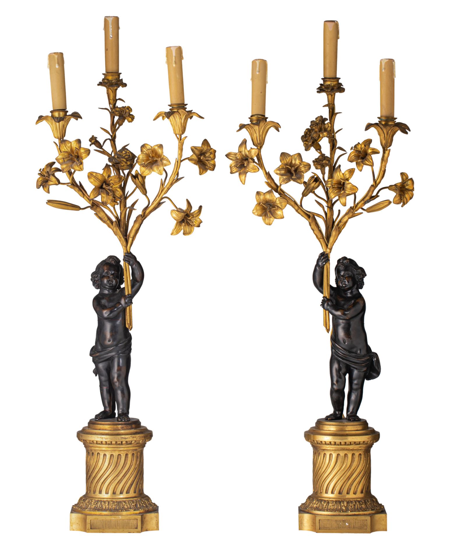 A pair of Neoclassical patinated and gilt bronze figural candelabras, H 80 cm