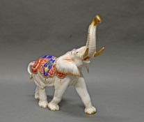 Porzellanfigur, "Elefant", Aelteste Volkstedter Porzellanfabrik, 20. Jh., mit erhobenem Rüssel und 