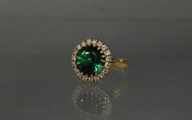 Ring, GG 750, 1 runder grün-blauer Turmalin ca. 7.0 ct., ca. 12 x 12 x 7.75 mm, 19 Brillanten zus. 