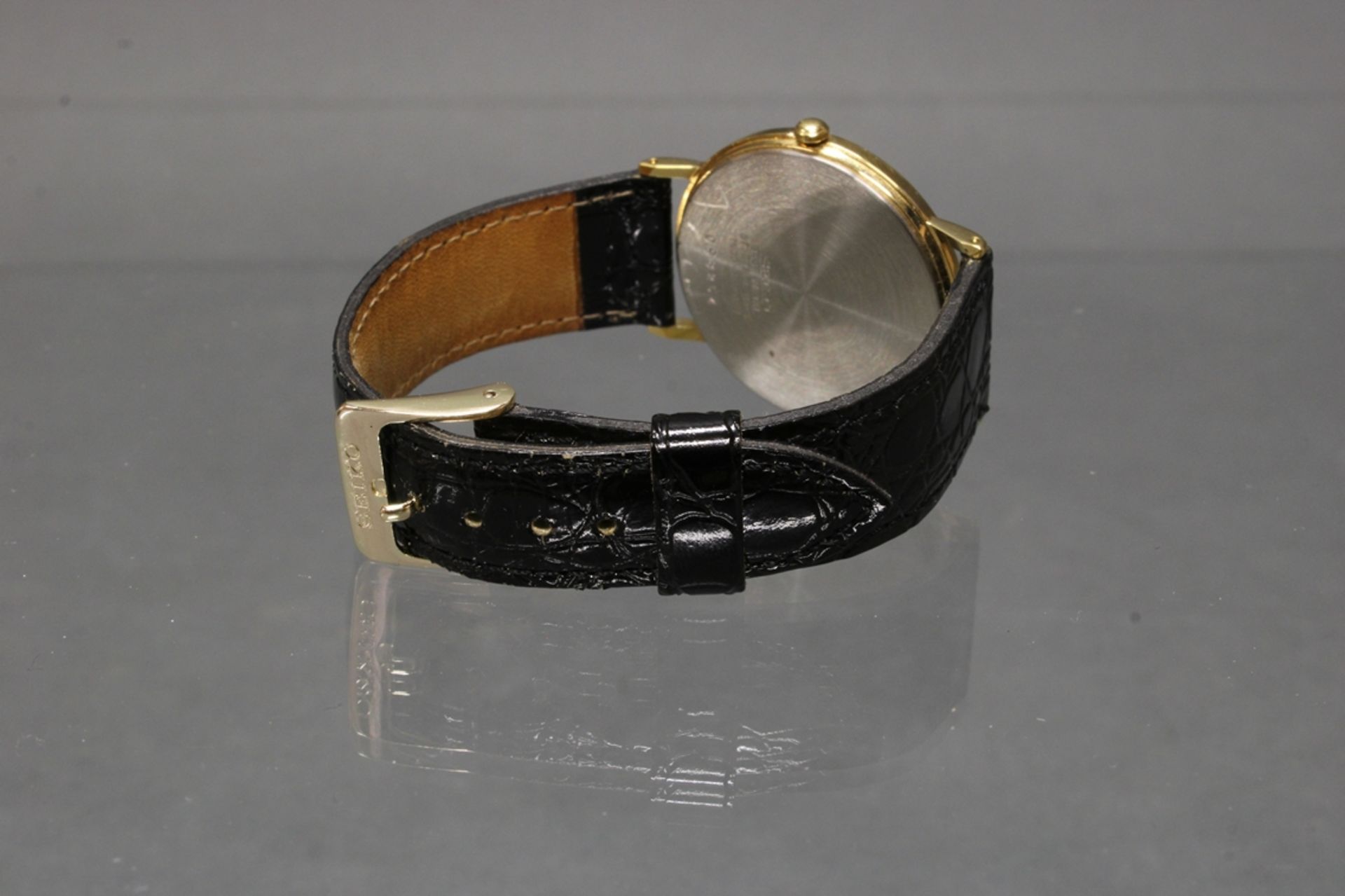 Herrenarmbanduhr, Seiko, Quarz, Stahlgehäuse, teils vergoldet, Gehäuse-Nr. 098254, schwarzes Ziffer - Image 4 of 4