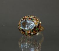 Ring, GG 750, oval facettierter Topas, Ringkopfrand multicolor: Saphir, Turmalin, Tsavorit, Granat,