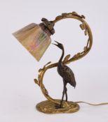 Tischlampe, "Reiher an Ranke", Anfang 20. Jh., bronziertes Metall, farbiger Glasschirm vierseitig, 