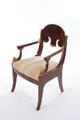 Fauteuil im Empire-Stil, 19./20. Jh., Mahagoni, geschnitztes ornamentales Dekor mit goldener Fassun