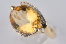 Ring, GG 585, oval facettierter Citrin, neun Brillanten, ca. 7.75 g, RM 19.5, ein Brillant fehlt