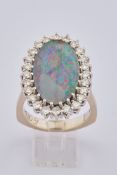 Ring, WG 585, Opal, zentral gefasst, Karmoisierung aus Brillanten zus. ca. 1.20 ct., RM 18, 10.32 g