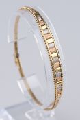 Armband, WG/GG/RG 585, filigran gefügte Glieder in abwechselnden Goldtönen, ca. 8 g, Länge 19.5 cm