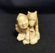 NETSUKE "MANN MIT HUND"