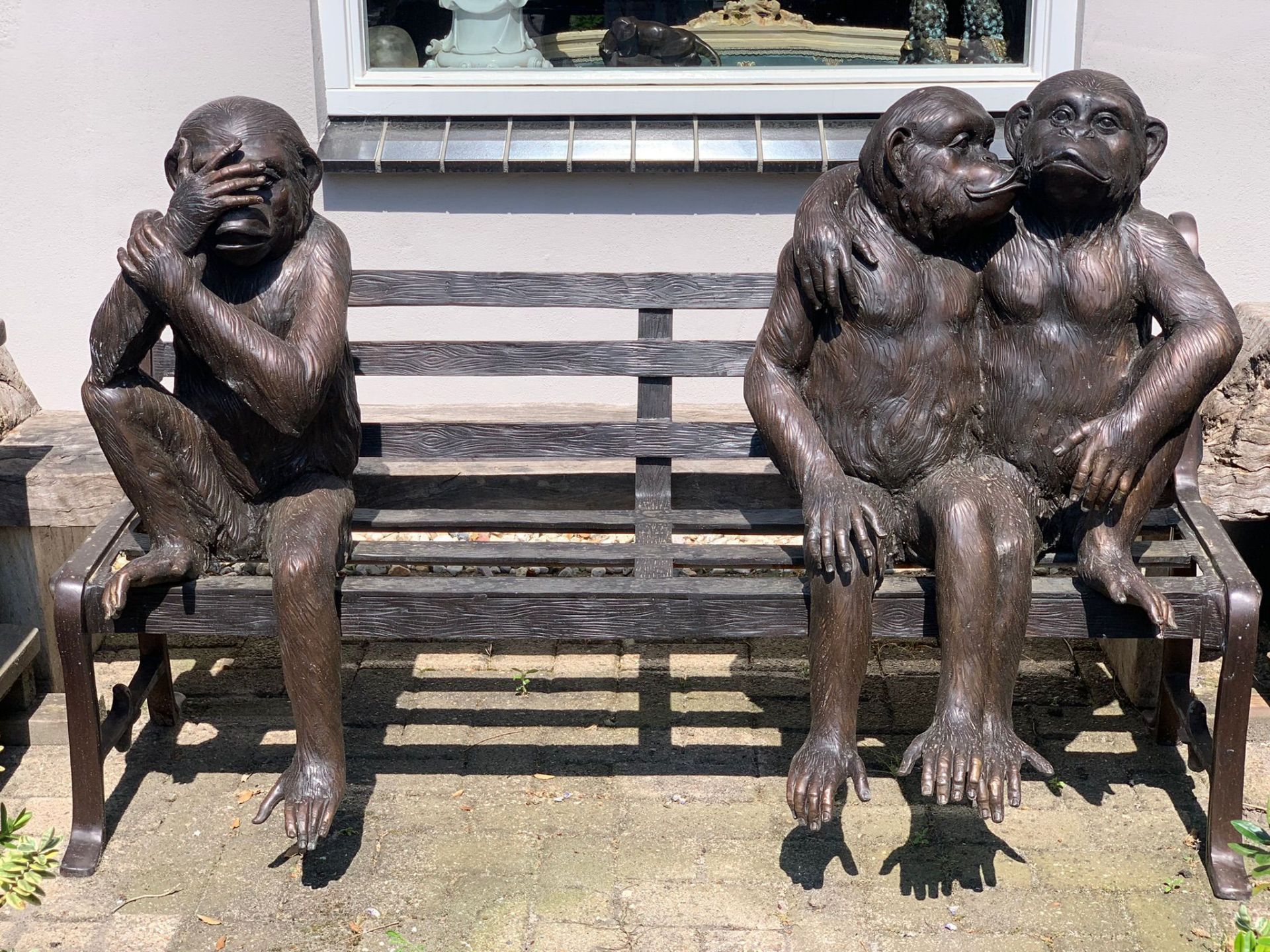 SCUKLPTURAL GARDEN BENCH WITH CHIMPANZEES