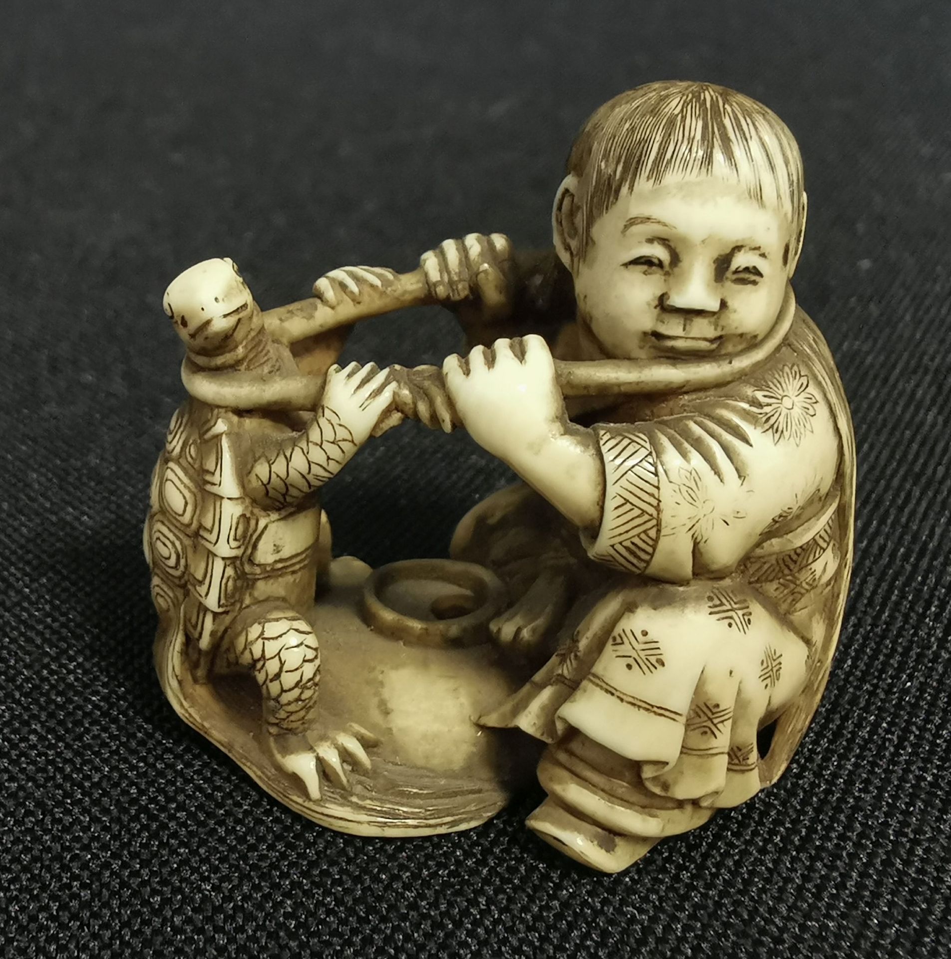 FINE NETSUKE: CHILD WITH TURTLE