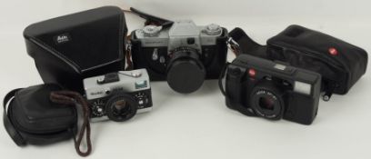 Konvolut dreier Kameras, Leicaflex, Leica AF-C1 und Rollei 35 SE.