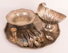 Silver convolute of plates, bowls and spoons.