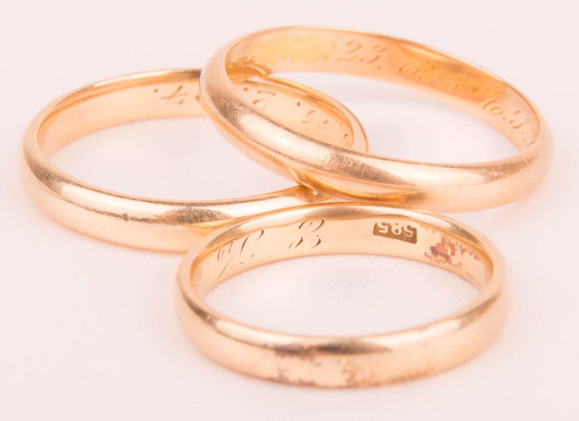 Three wedding rings with engraving, 585 yellow gold, 1st half 20th century.