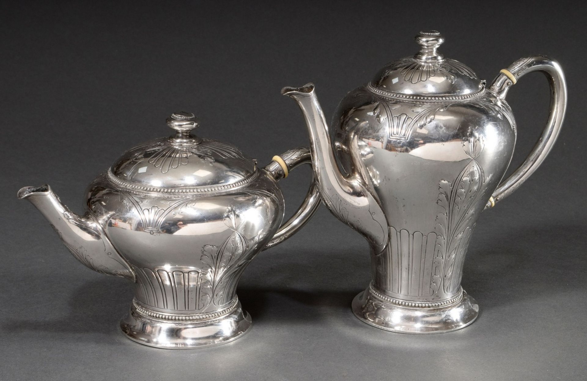 2 Various Art Nouveau coffee and tea pots with engraved and reliefed ornamental decoration and bead