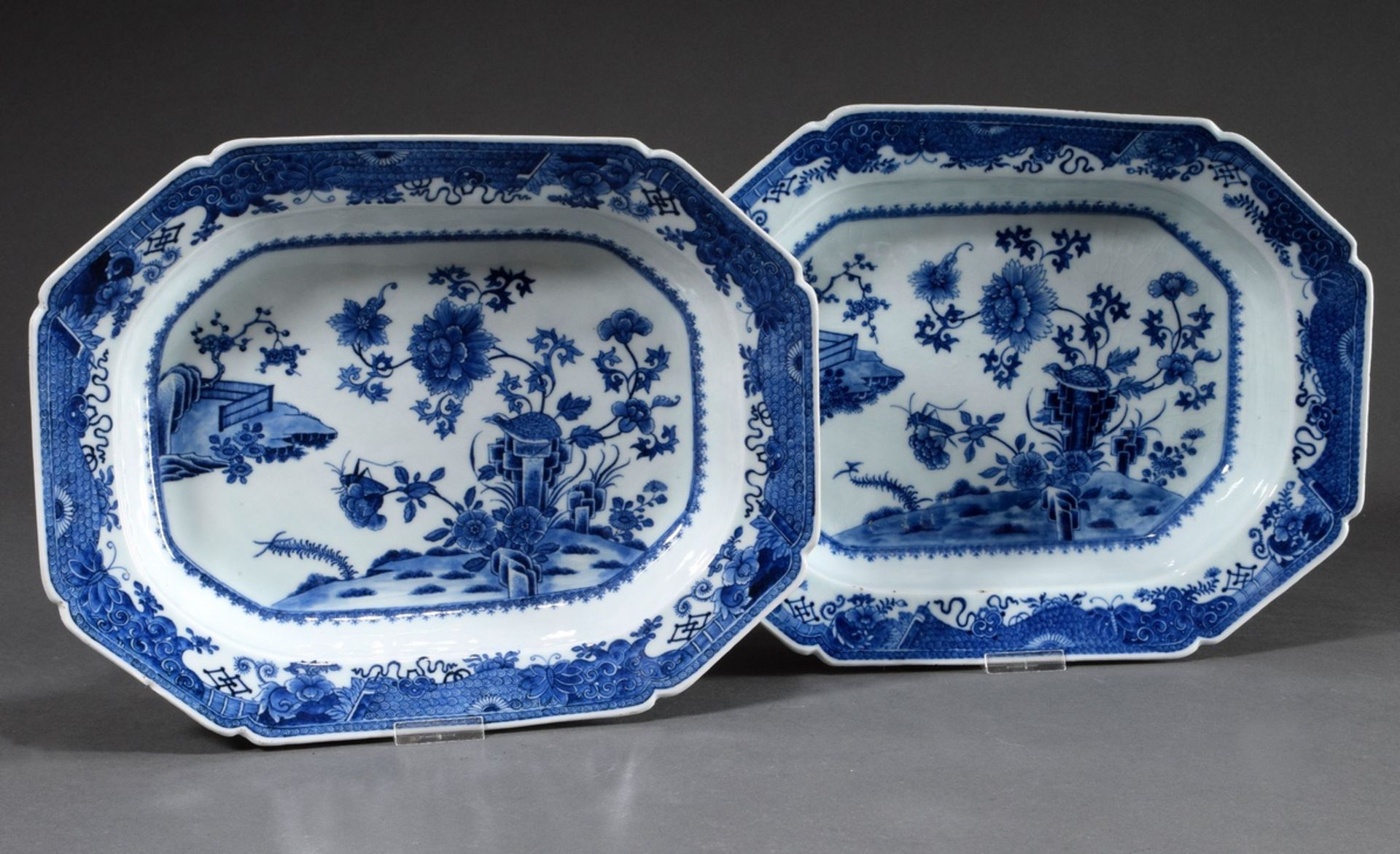 Pair of deeply moulded octagonal plates with fine blue painting decoration "Garden with Partridge a