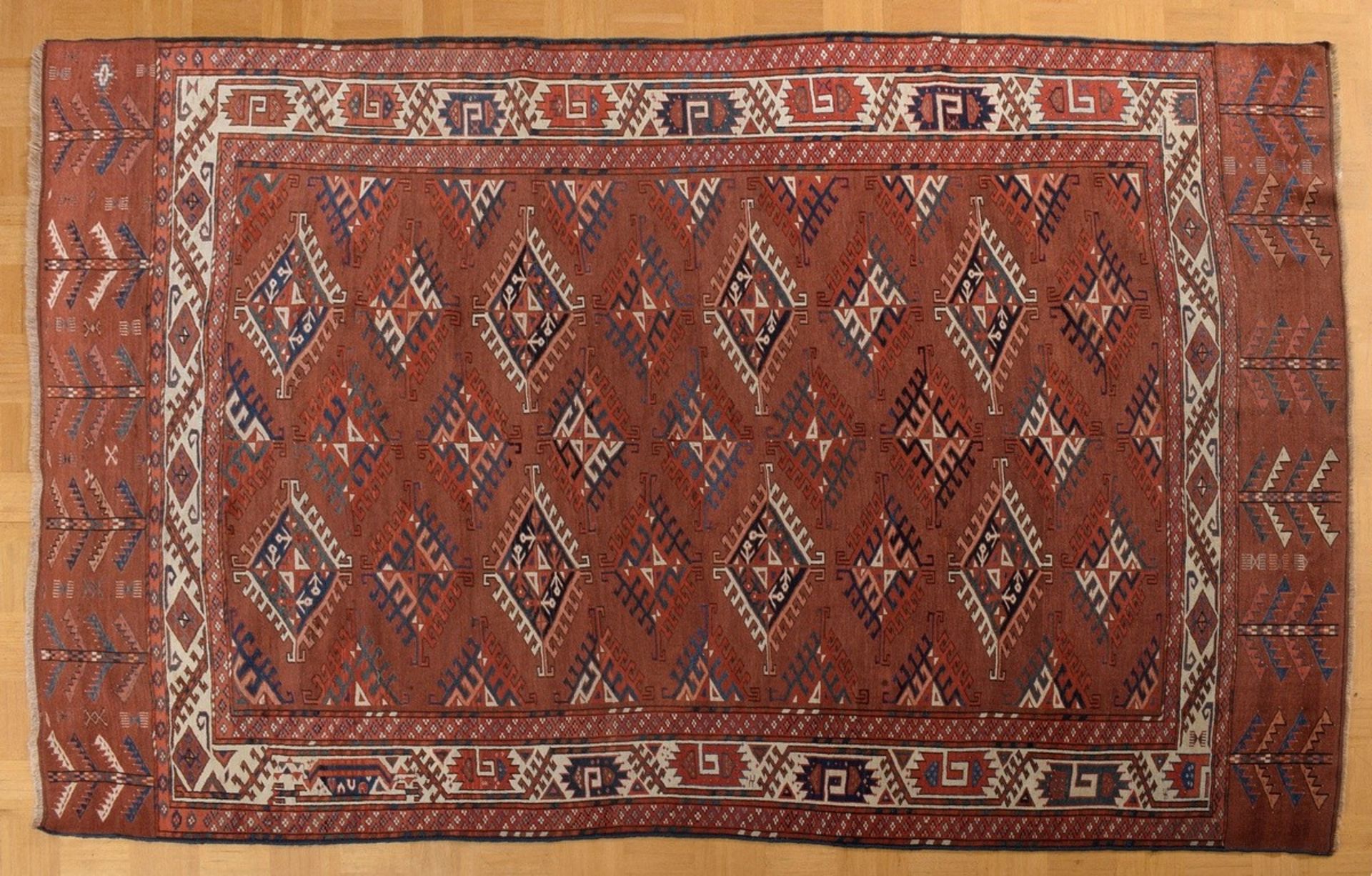 Yomut Dyrnak main carpet with a field design of Dyrnak güls in various versions, white-ground main 