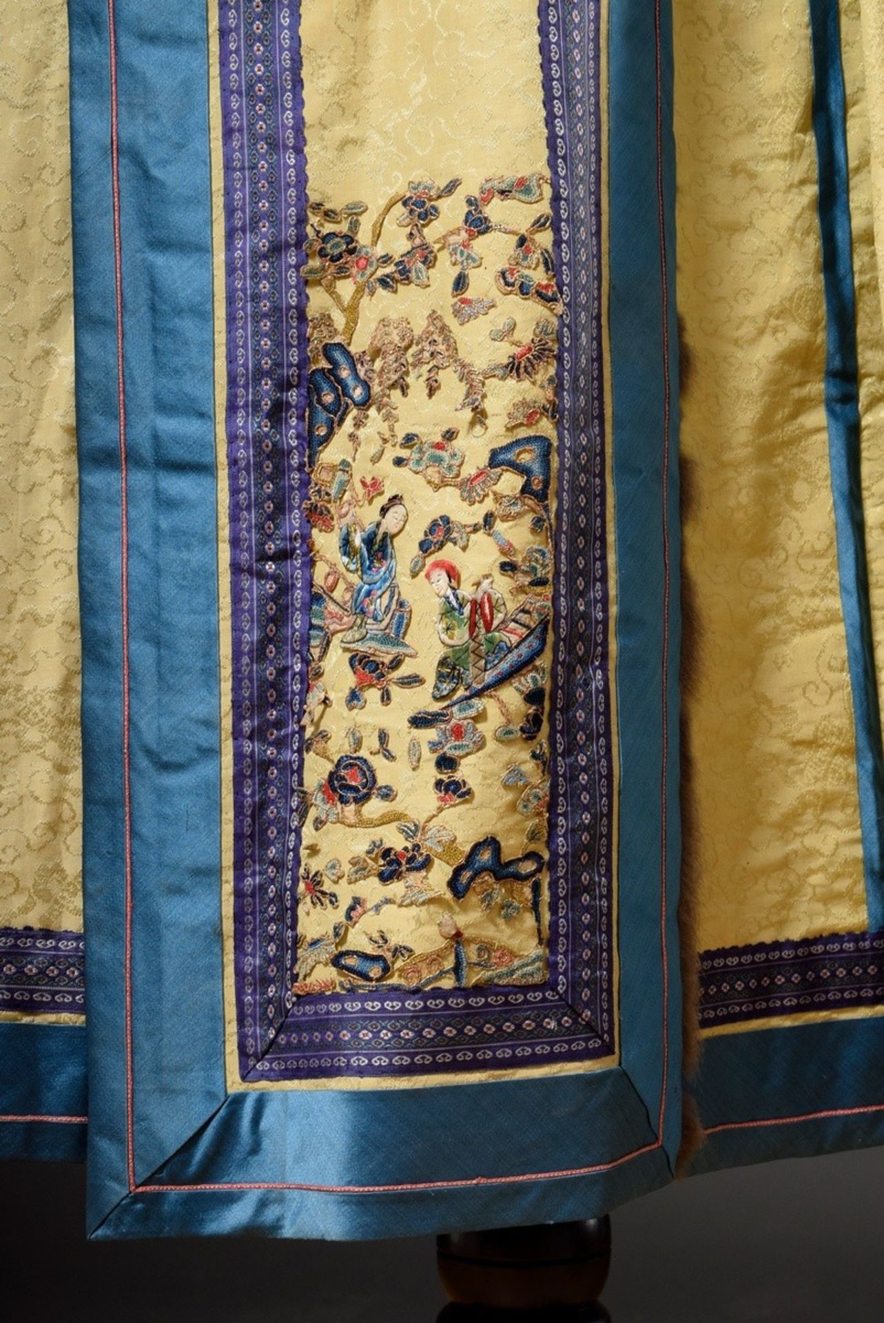 Chinese skirt of light yellow silk damask with blue borders, fairy fur trimming and coloured embroi - Image 4 of 4