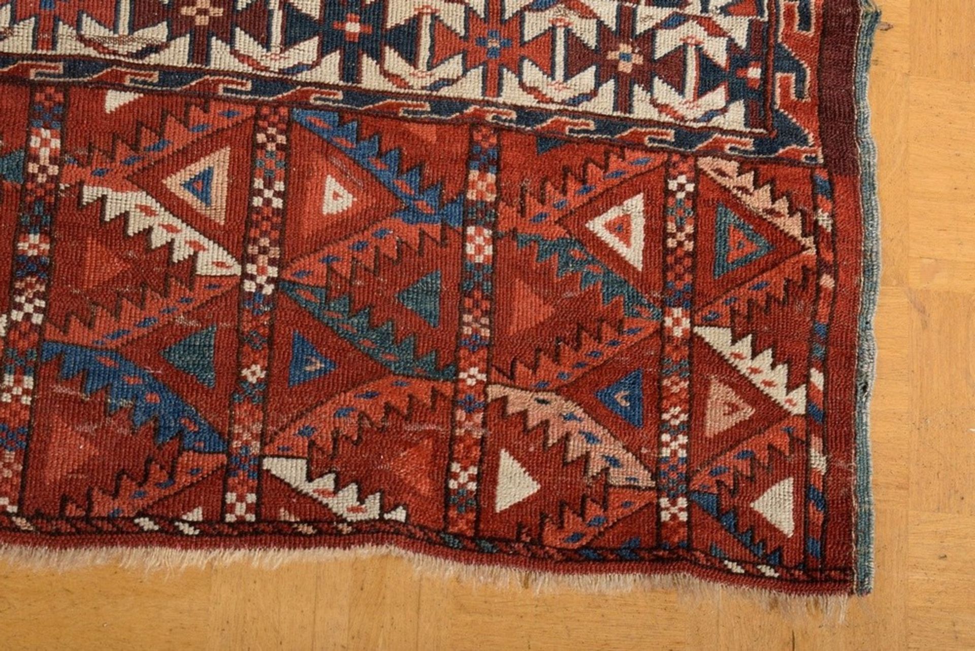 A Yomud main carpet with flat kepse güls arranged in offset colours, a white-ground main border wit - Image 3 of 7