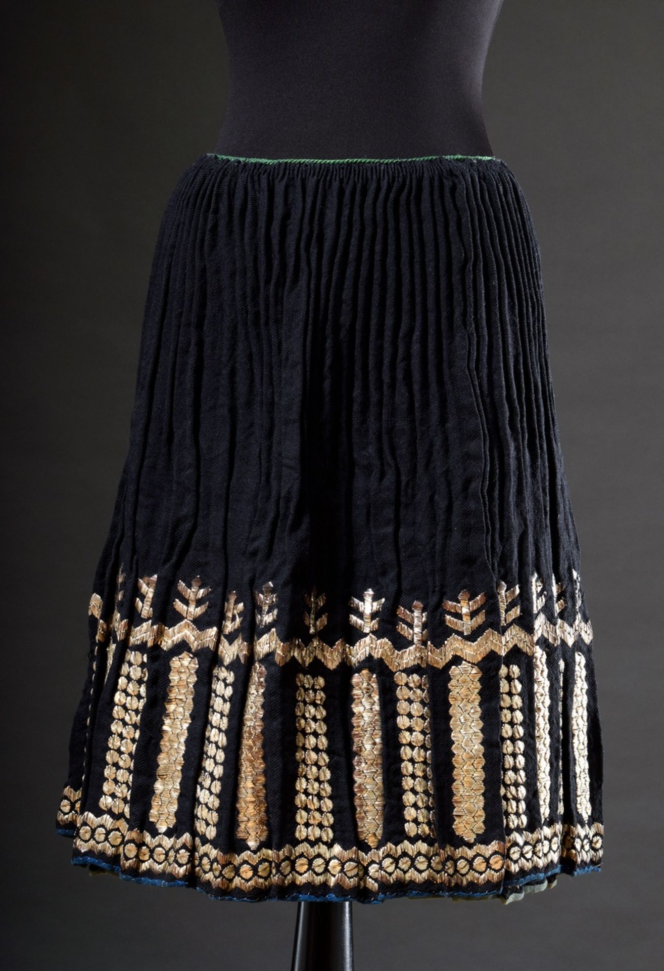 Black traditional wrap skirt of pleated wool with silver embroidery, heavy quality, probably Transy