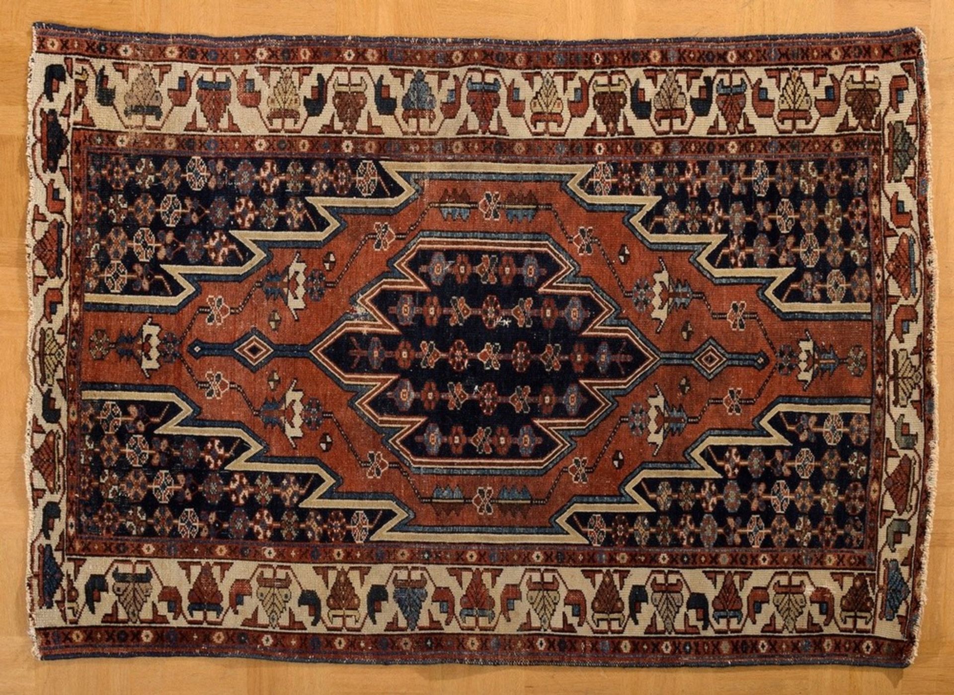 Mazlaghan carpet with typical outline of sharp serrations around the central medallion on a pattern