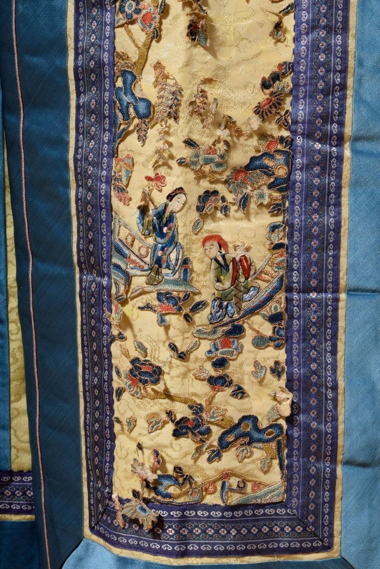 Chinese skirt of light yellow silk damask with blue borders, fairy fur trimming and coloured embroi - Image 2 of 4