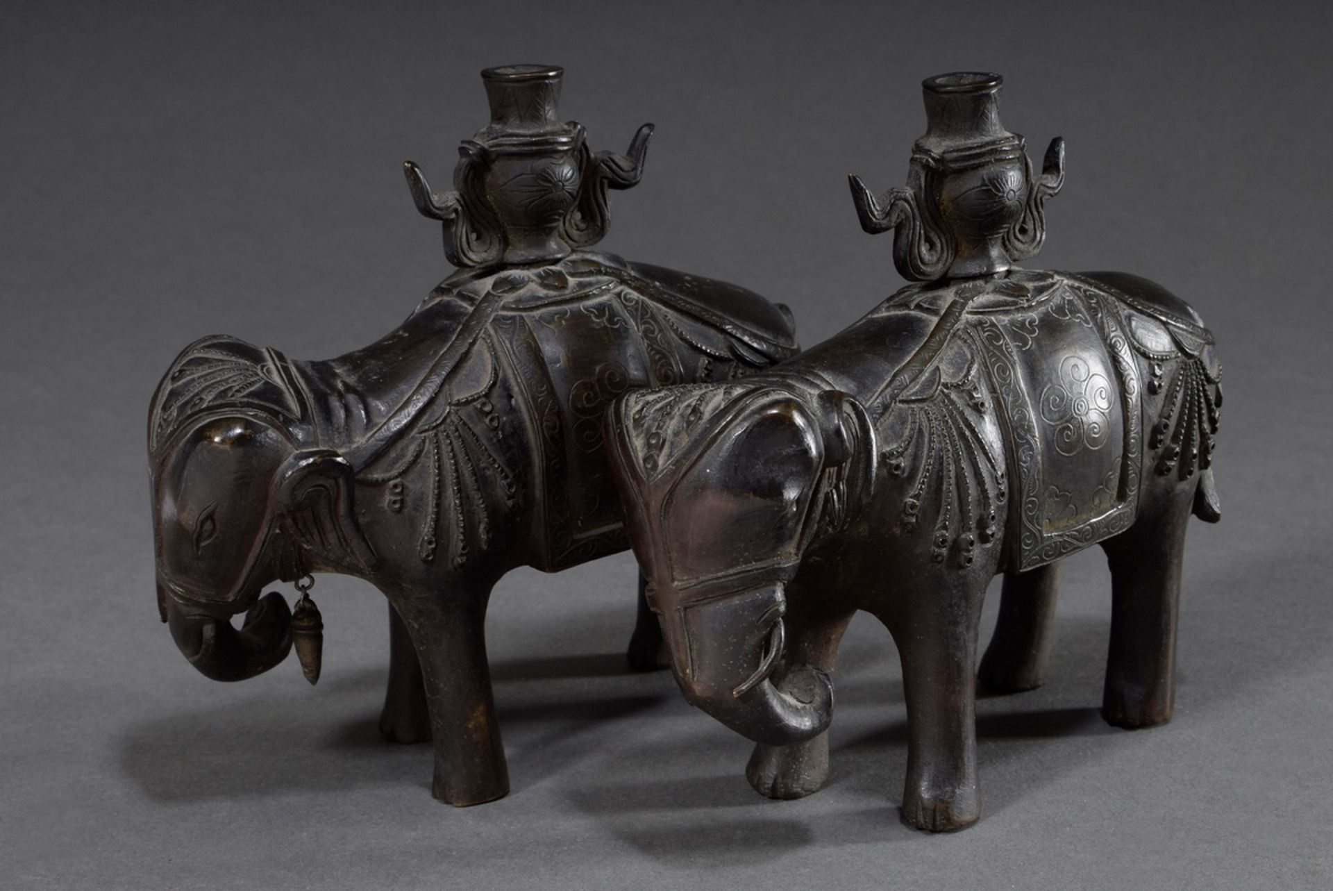 Pair of Chinese bronze elephants with vases on their backs, formerly candlesticks of an altar set o