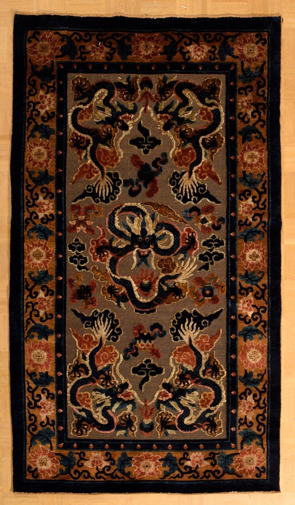 Chinese palace carpet "Dragon" with four dragons chasing the flame pearl in the corners and a large