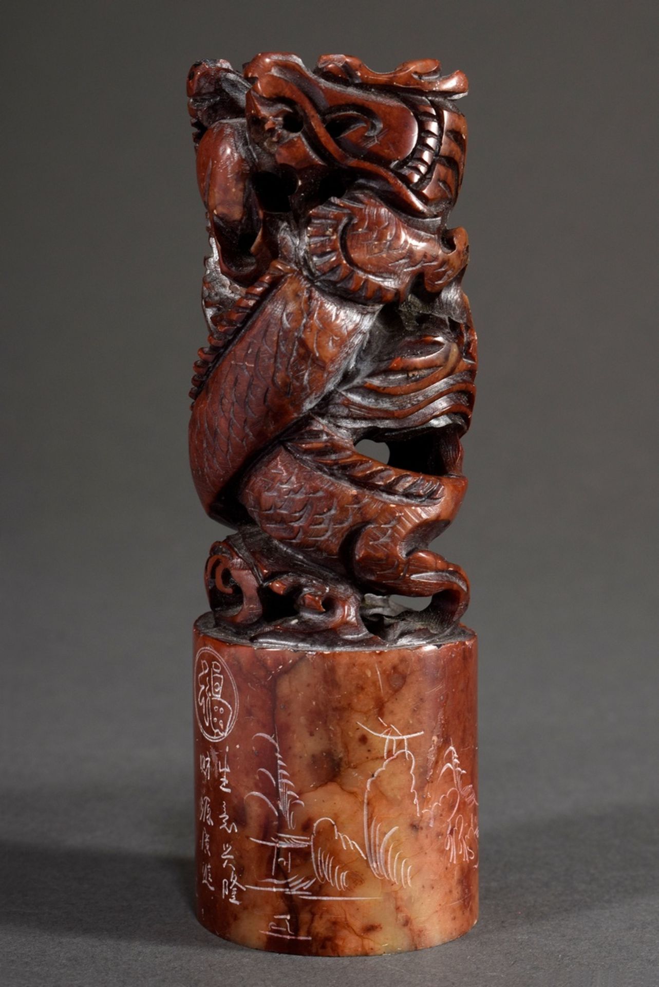 Red soapstone seal with plastic handle "dragon couple" and engraved landscape decoration as well as