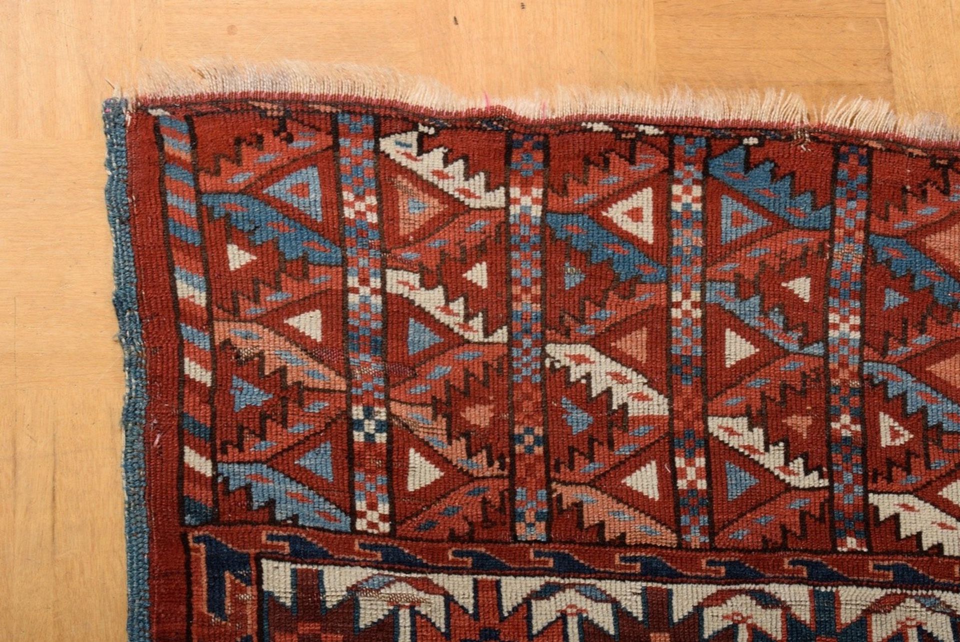 A Yomud main carpet with flat kepse güls arranged in offset colours, a white-ground main border wit - Image 5 of 7