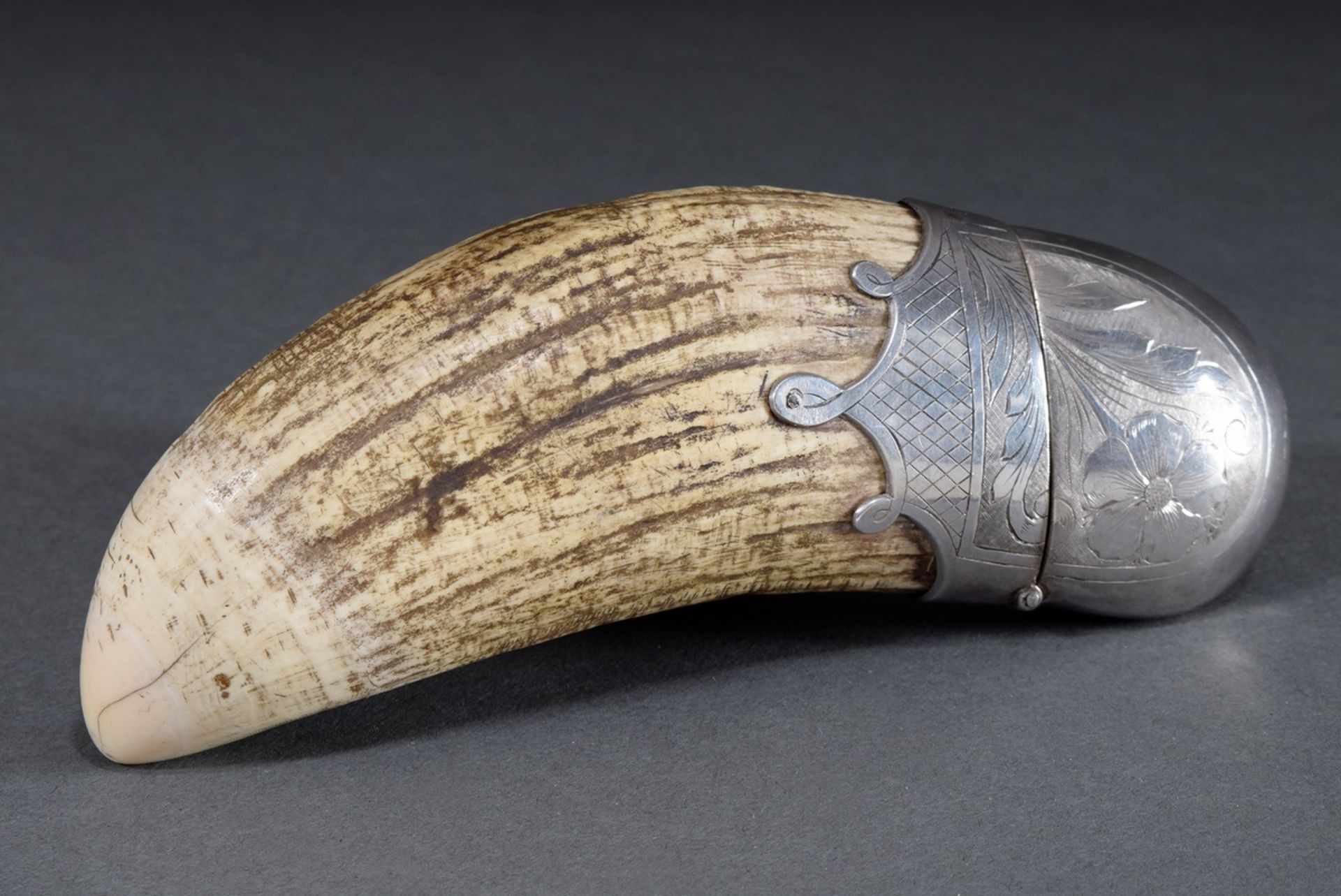 Whale tooth with floral engraved silver mount worked as match case, without hallmarks, around 1900,