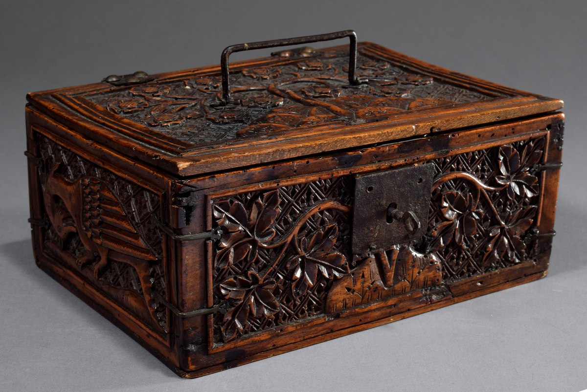 Large minstrel's box with relief carvings "Blossom tendrils and fantastic birds" as well as iron fi