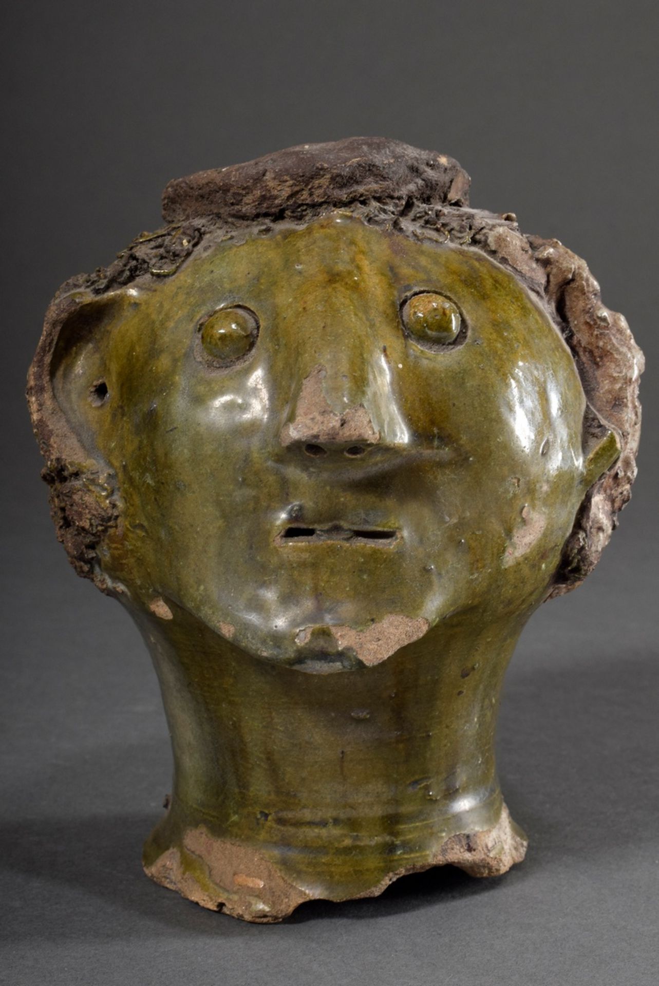 Fragment of a clay sculpture "Male head with curls and hat", sphere of Gerhard Marcks (1889-1981), 