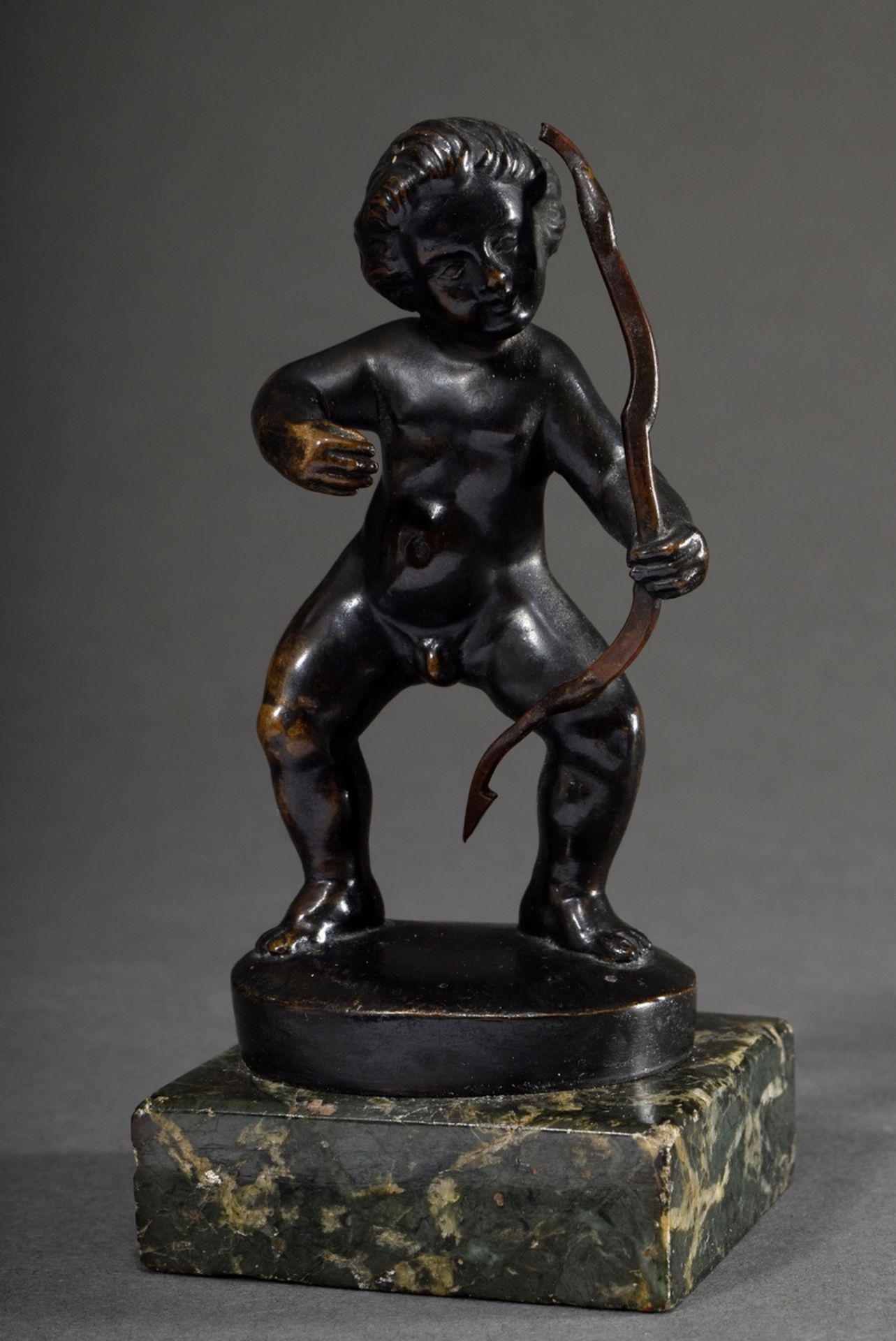 Nachtmann, Franz (1883-1942) "Cupid with bow", bronze, plinth signed, on stone base, h. 10/12cm, sl