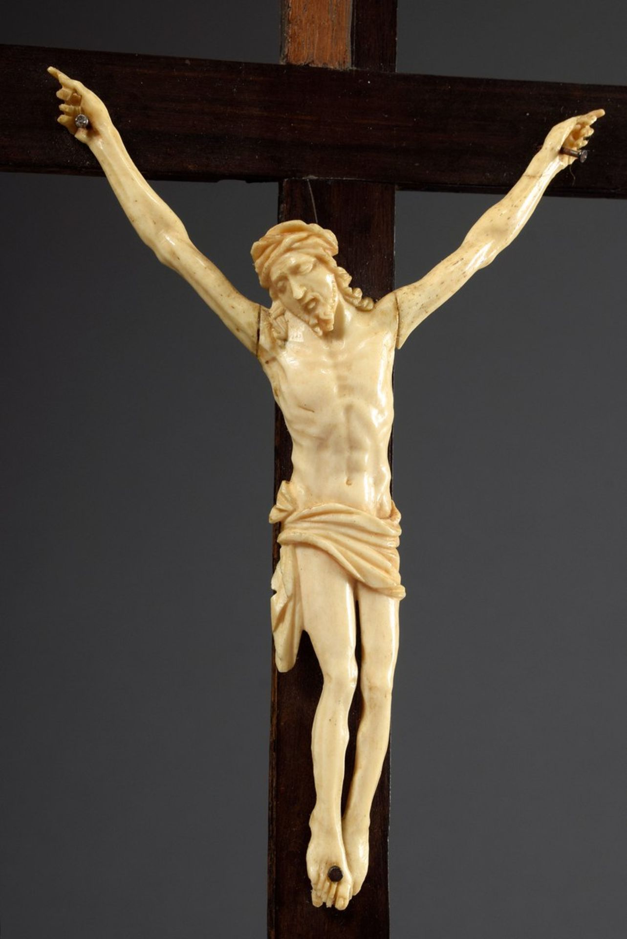 Ivory carving "Corpus Christi" (three-nail type) with the arms stretched far upwards and the head t