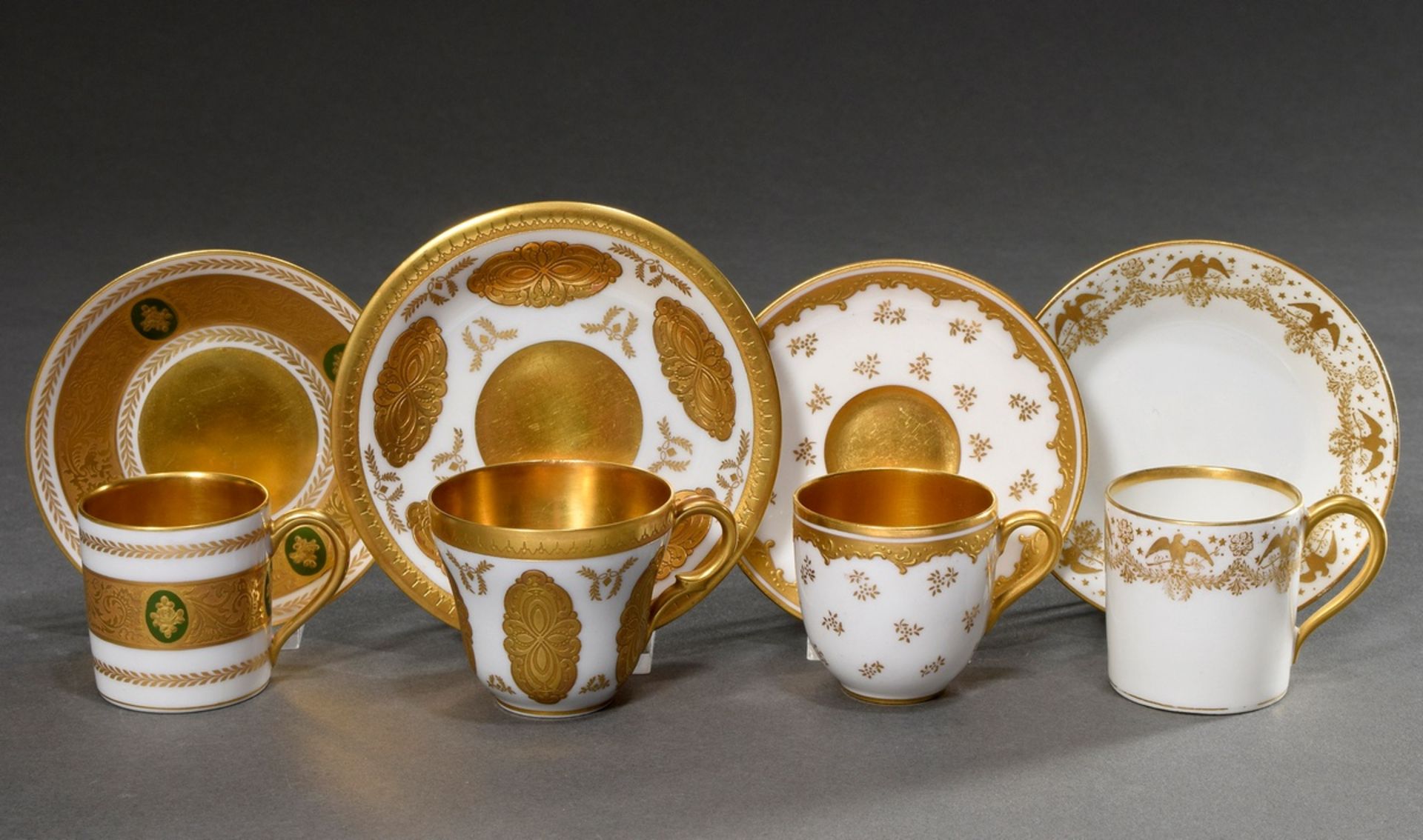 4 Various porcelain mocca cups/saucer with different floral and ornamental decorations on white bac