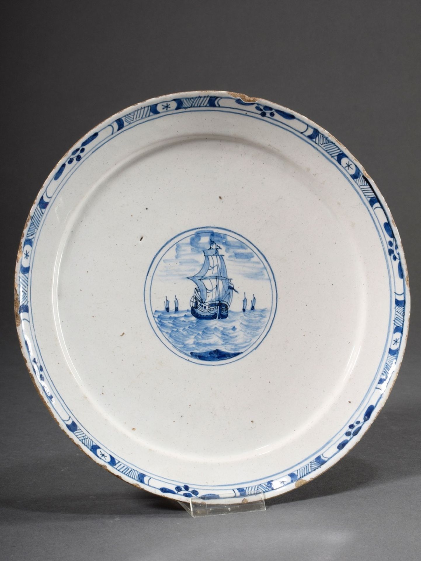 Small Delft faience plate with blue painting decor "Sailing ship on the high seas", beige body, 18t