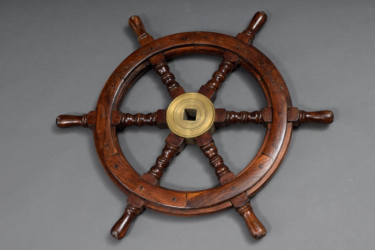 Small ship steering wheel with 6 turned baluster spokes, mahogany with brass fittings and iron hub,