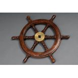 Small ship steering wheel with 6 turned baluster spokes, mahogany with brass fittings and iron hub,