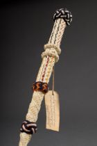 Sailor's work, walking stick made of cordage over metal core, inscr. on note, l. 103cm, signs of ag