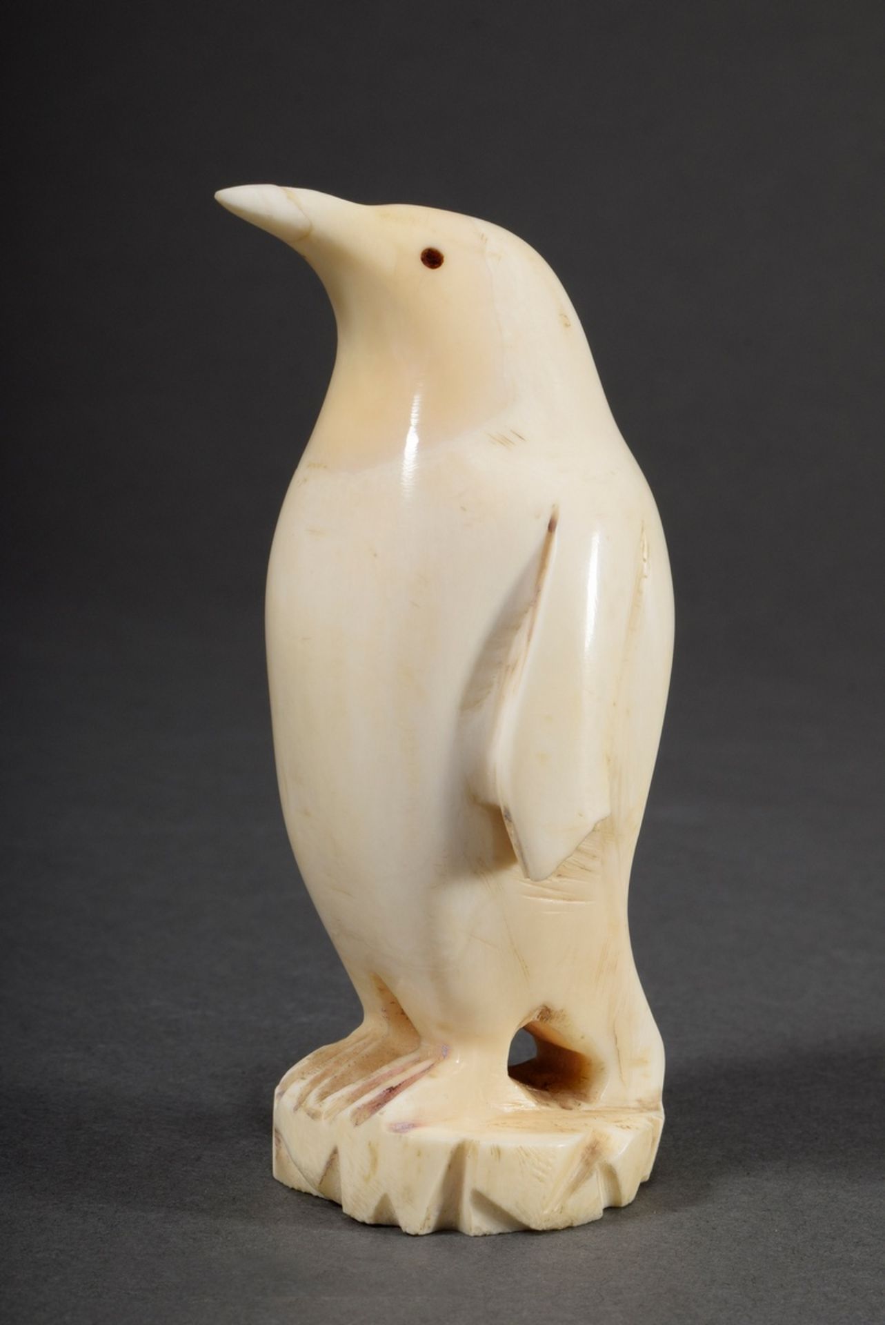 Scrimshaw "Penguin" of carved whale tooth with whale beard inlays, Inuit work, 19th c., h. 10.5cm, 