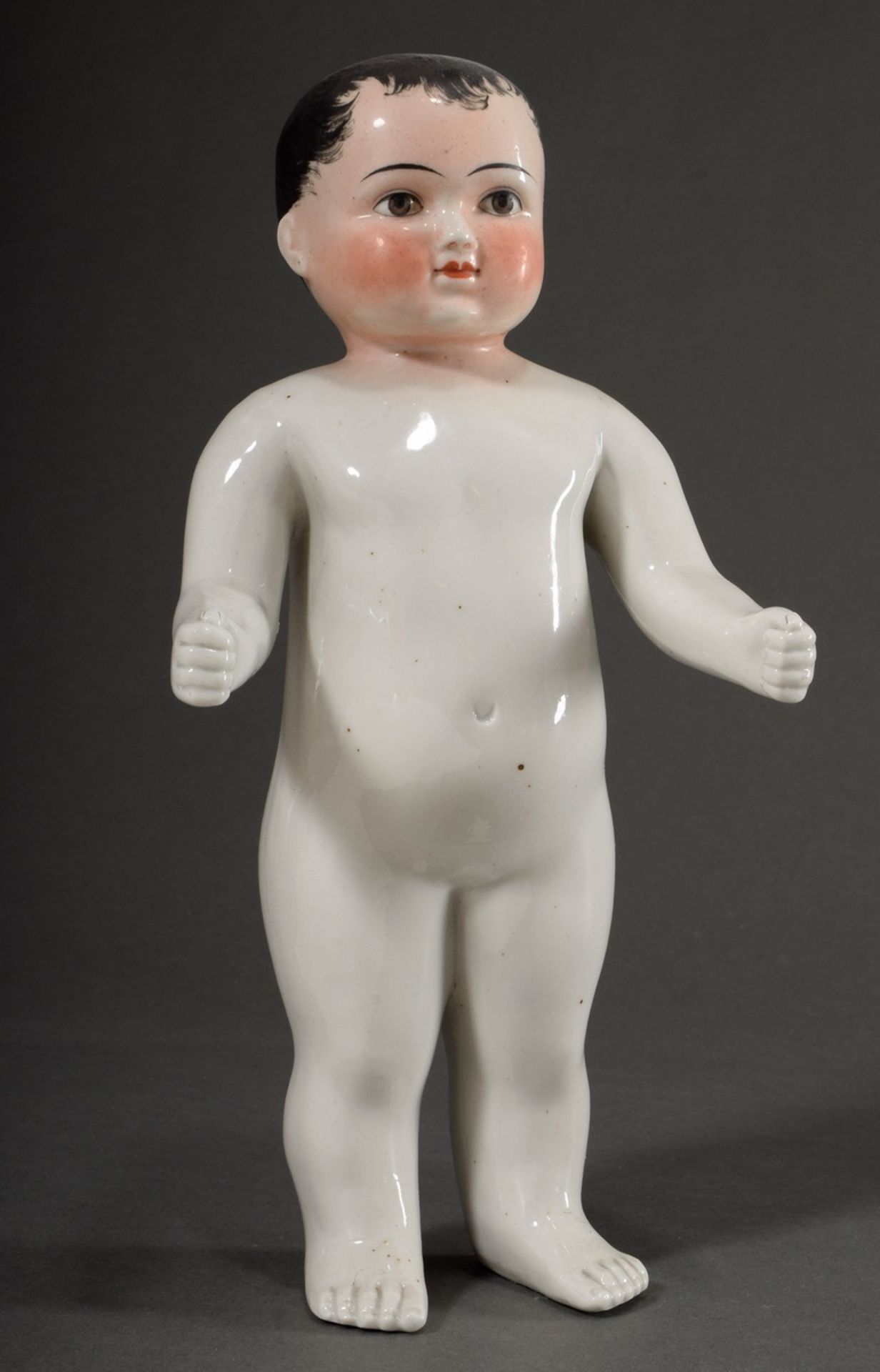 Porcelain bathing doll "Frozen Charlotte" with polychrome painted face, 19th c., h. 33cm, slight si