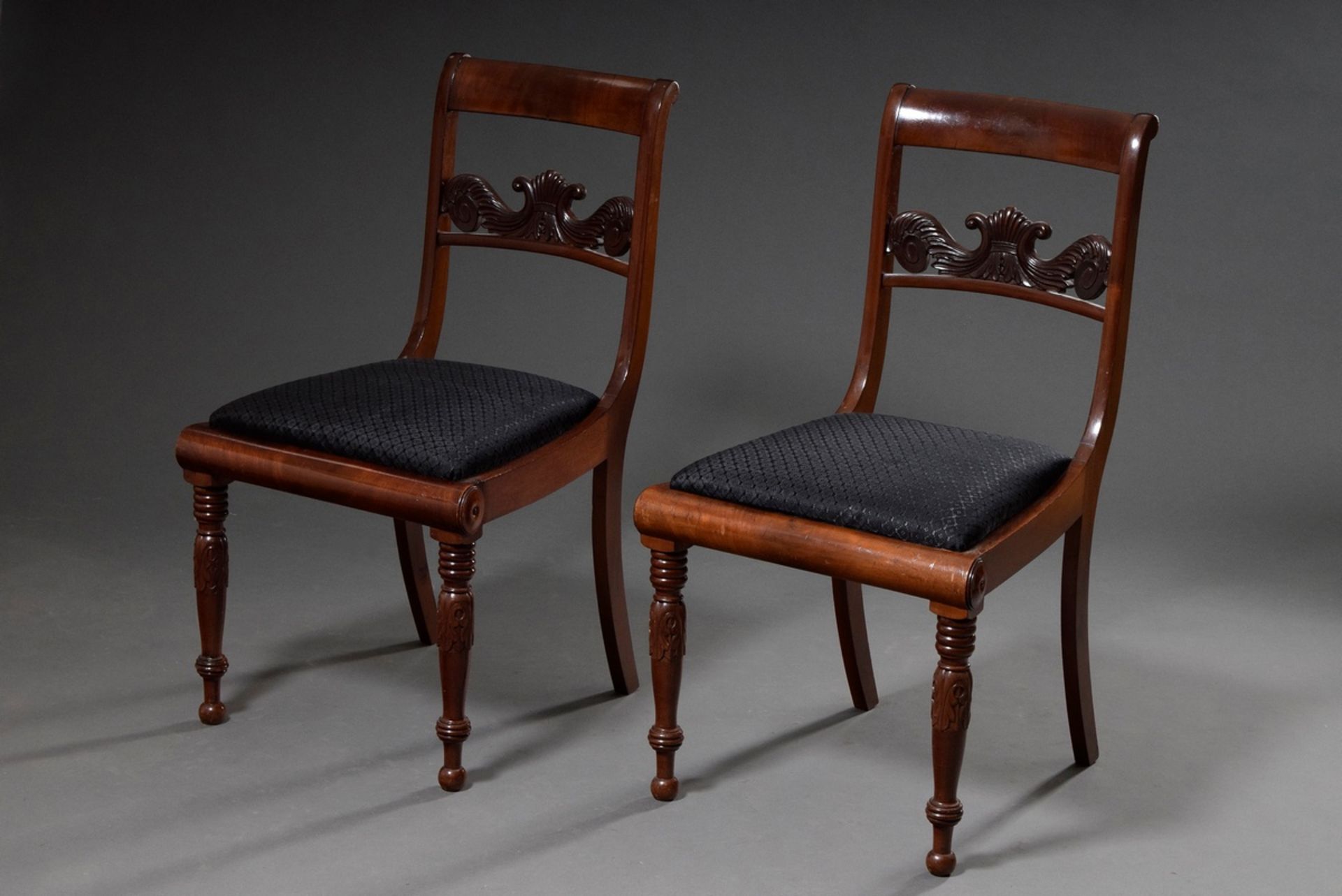 Pair of Biedermeier chairs with floral carved back board, turned legs and horsehair upholstery, mah